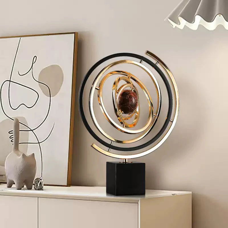 Close-up of gold rings and sphere on globe decoration for room decoration