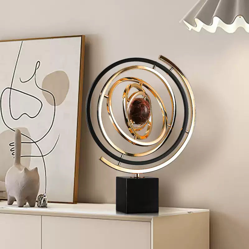 Close-up of gold rings and sphere on globe decoration for room decoration