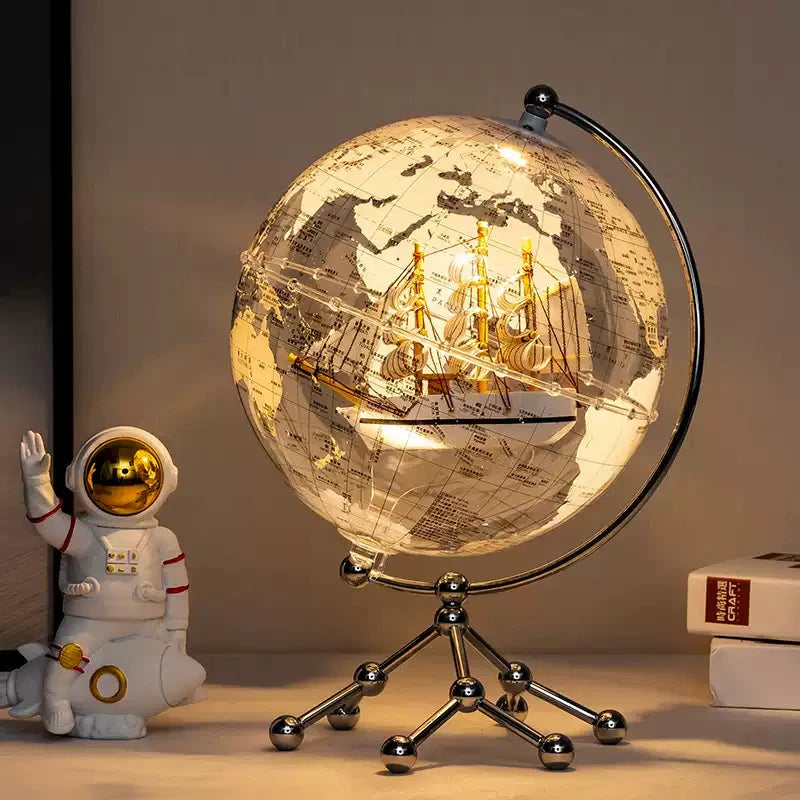 Close‑up of handcrafted sailboat inside clear globe decoration—perfect room decoration birthday gift