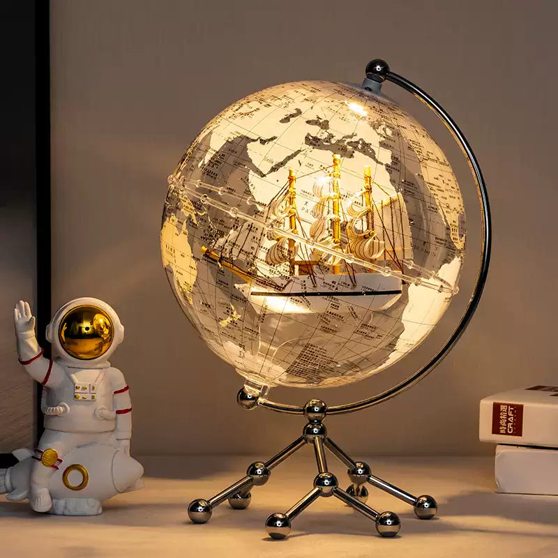 Close‑up of handcrafted sailboat inside clear globe decoration—perfect room decoration birthday gift