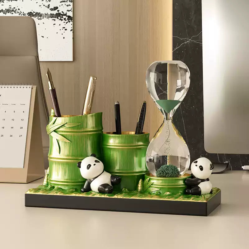 Desk close-up of panda bamboo pen holder with hourglass for time management tools