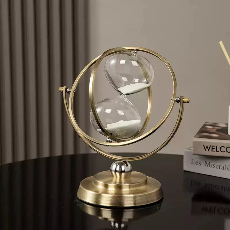 Close-up of armillary-style rings around glass bulbs—premium hourglass decor