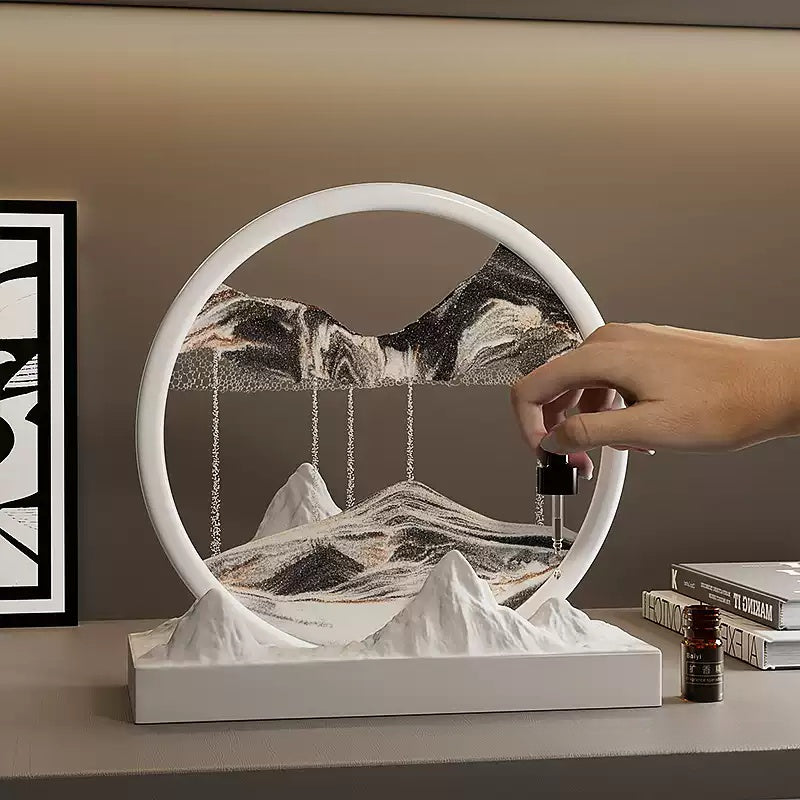 Hand adding essential oil to snow-mountain sandscape home fragrance for soothing room decoration birthday gift