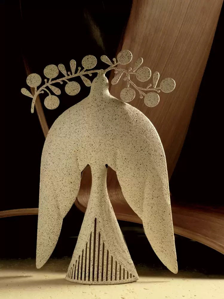 Minimalist bird sculpture with stone texture for desk decor