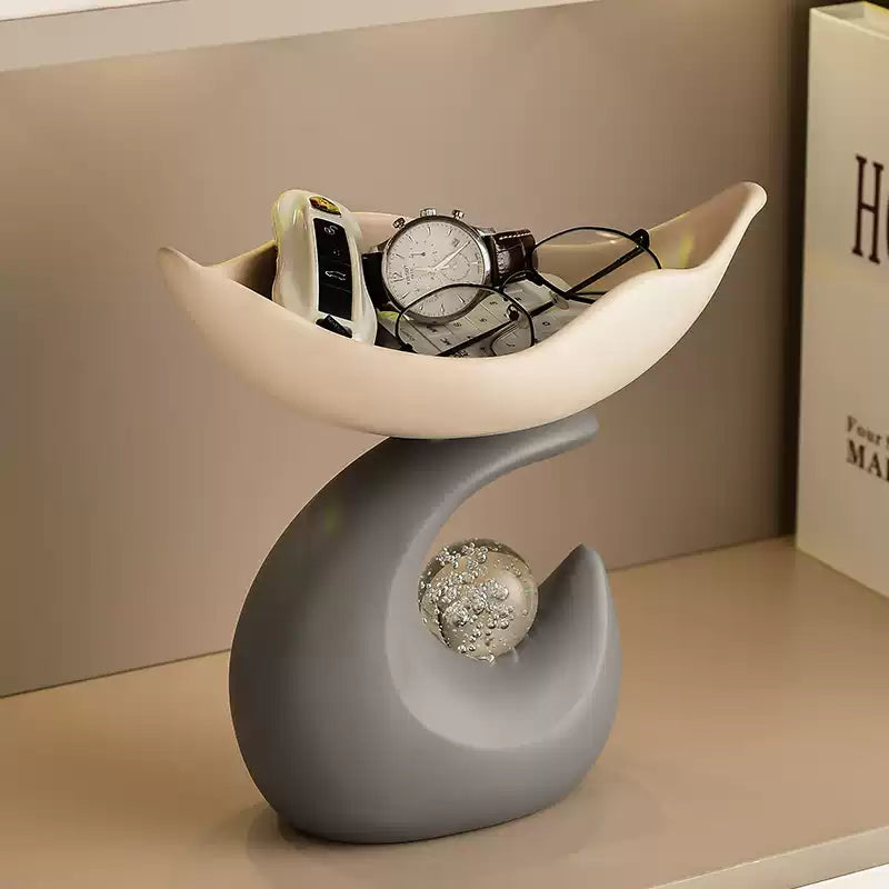 Top view of room key holder tray storing watch, keys and glasses